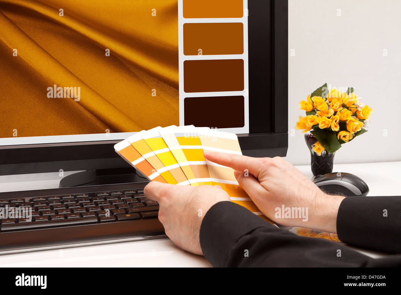 Graphic designer at work. Color samples. Brown, yellow images Stock Photo