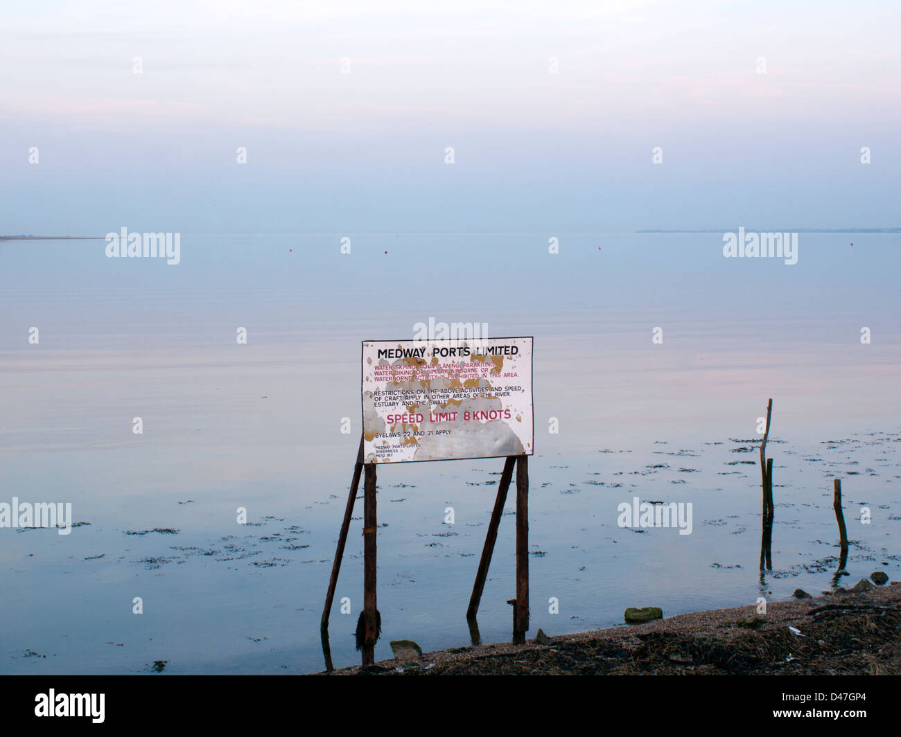 Calm waters of the Swale with sign Stock Photo