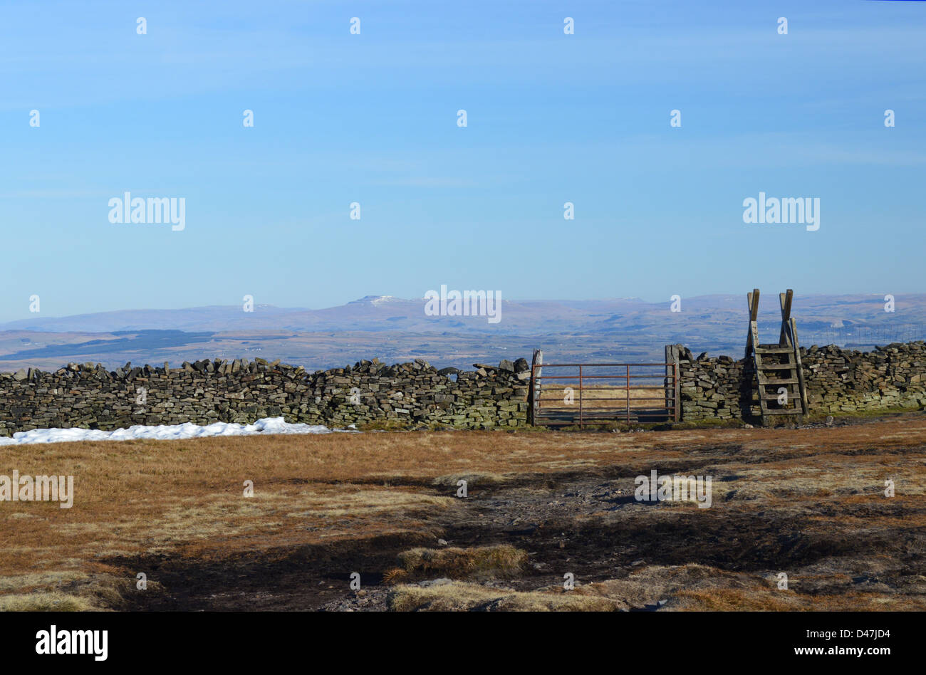Wooden Ladder Stile & Gate in Wall on the Summit Pendle Hill Looking Towards Ingleborough in The Yorkshire Dales National Park Stock Photo