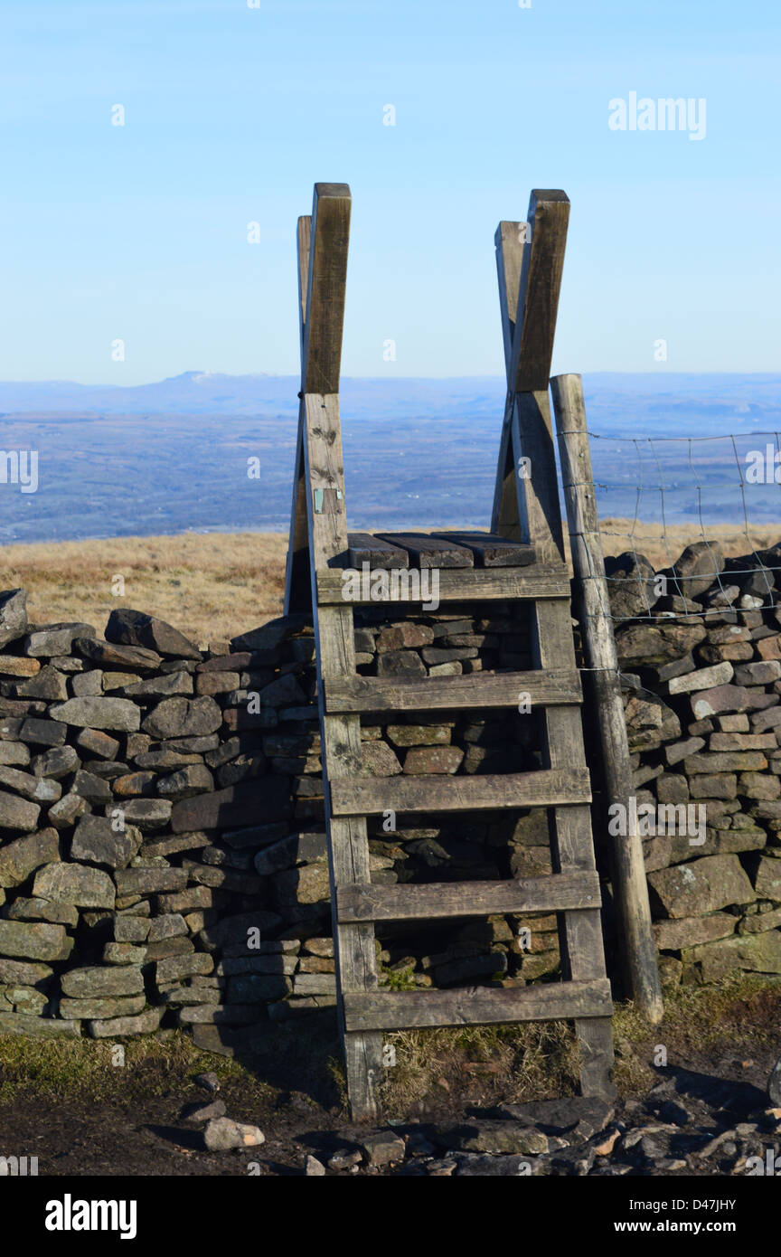 Wooden Ladder Stile & Dry Stone Wall on the Summit Pendle Hill Looking Towards Ingleborough in The Yorkshire Dales National Park Stock Photo