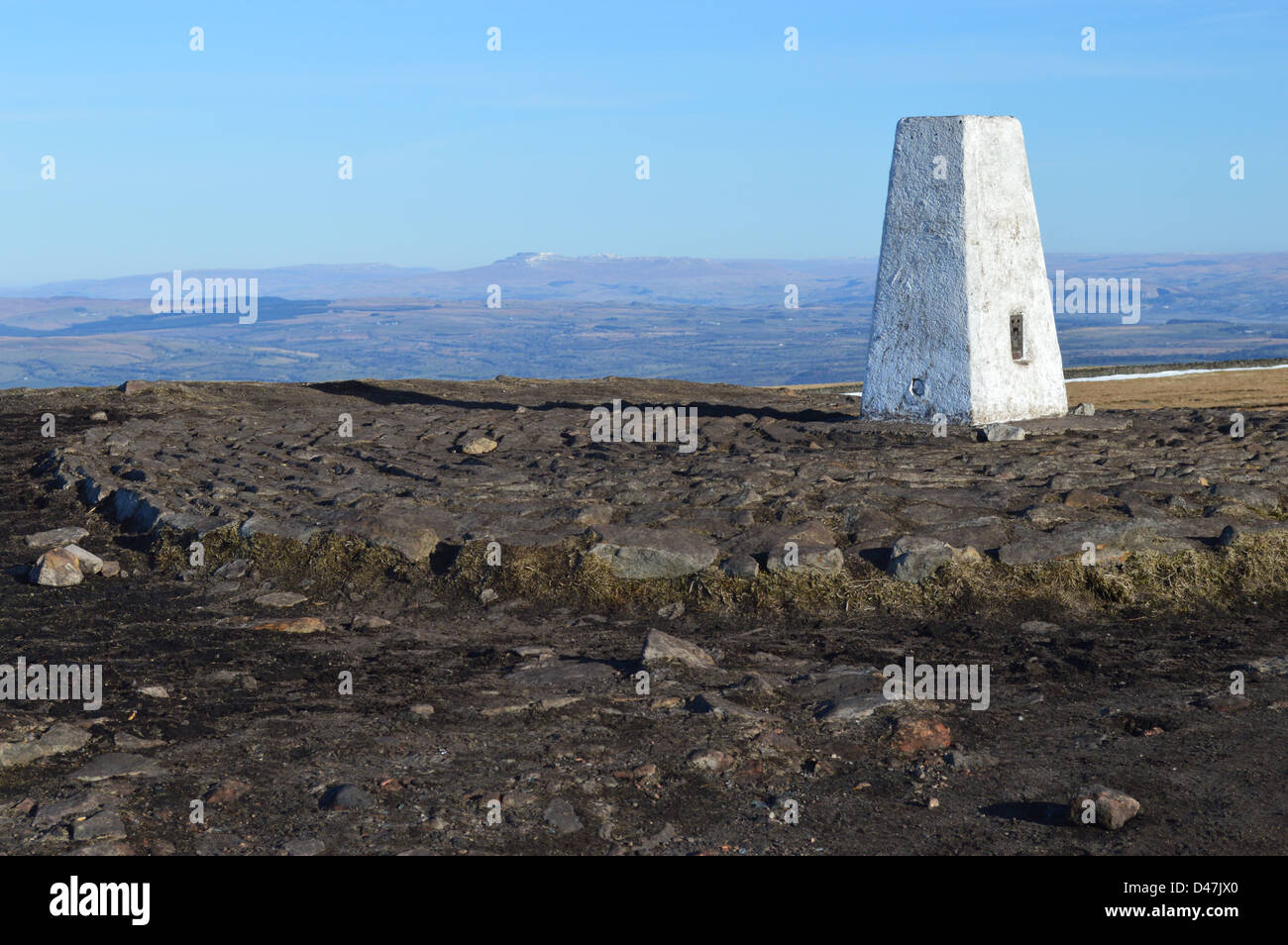The Summit Trig Point on Pendle Hill Looking Towards Ingleborough in The Yorkshire Dales National Park Stock Photo