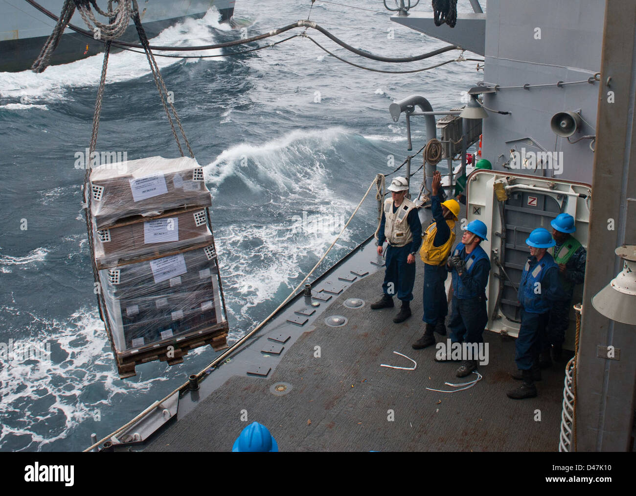 USS Cape St. George gets supplies. Stock Photo