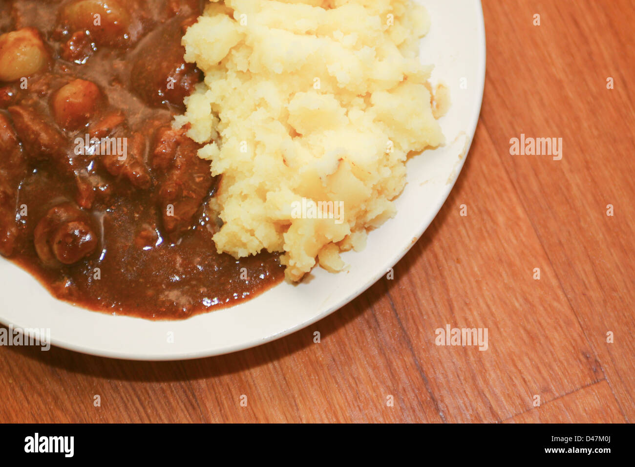 Beef bourguignon and mashed potato on plate Stock Photo