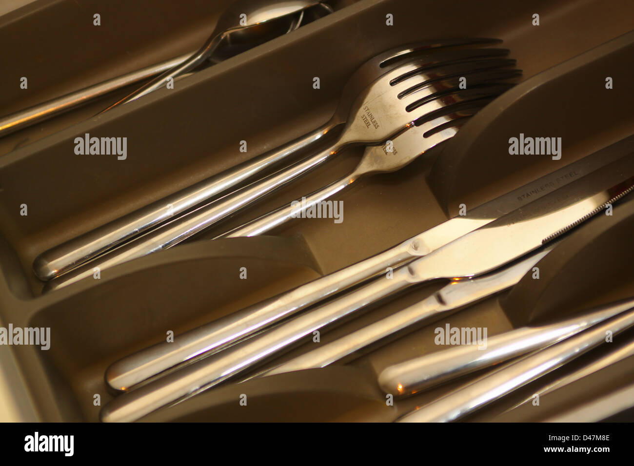 Stainless steel cutlery in trays in drawer Stock Photo Alamy