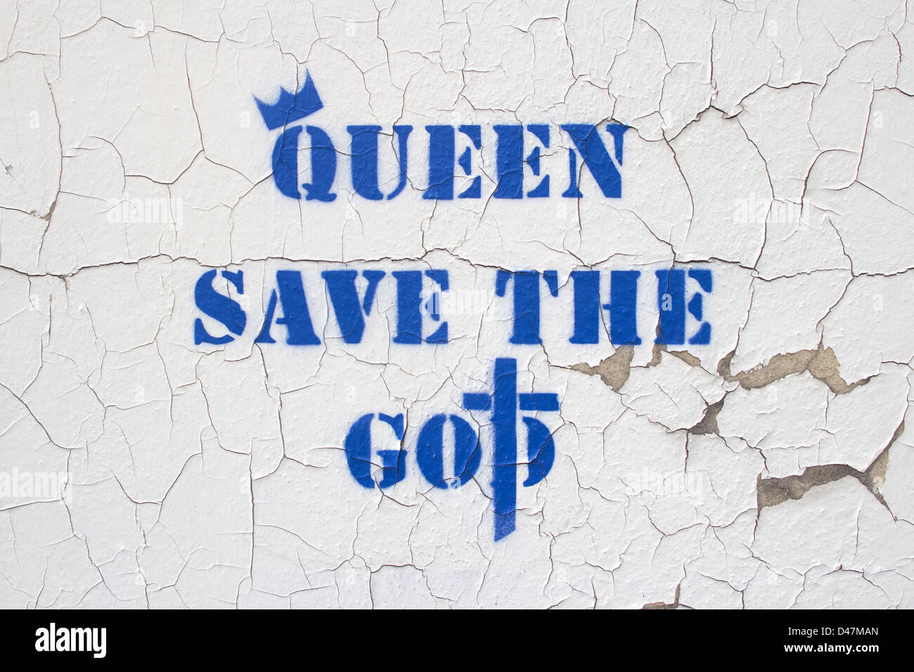 Some 'Queen Save The God' stencil art graffiti on a peeling wall in central London. Artist unknown. Stock Photo