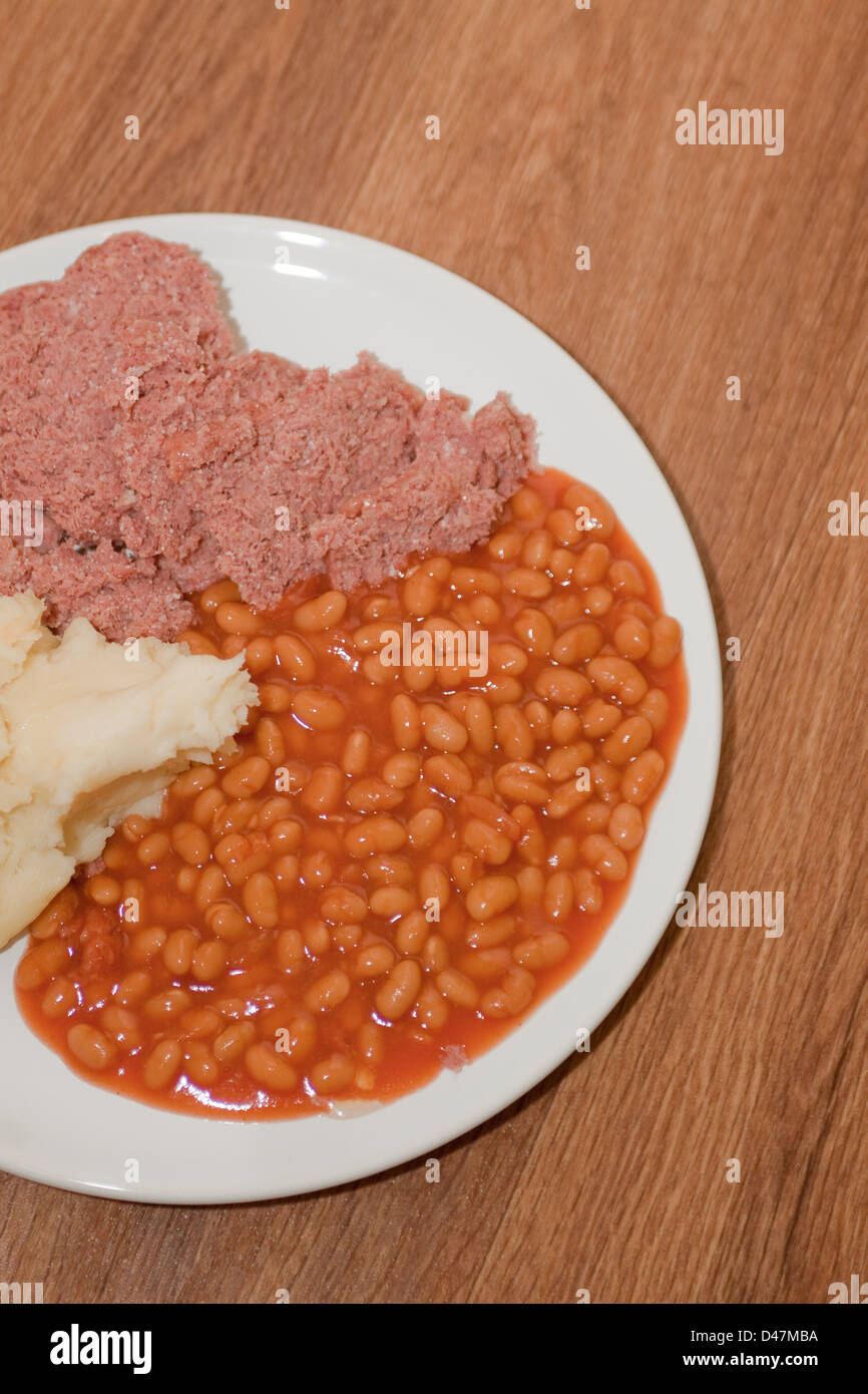 Corned beef baked beans and mashed potato meal on plate Stock Photo