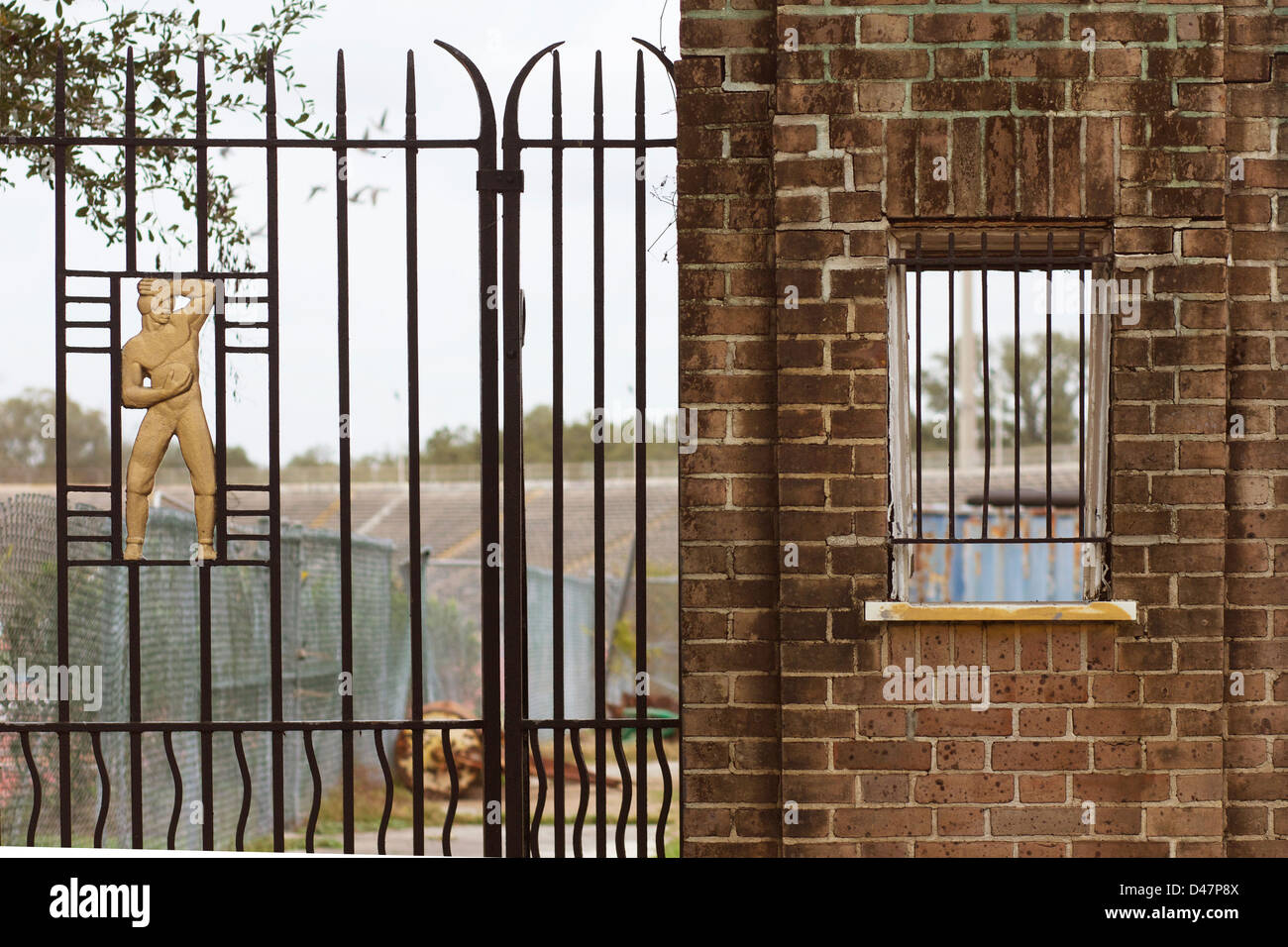 Art Deco fence with football player icon, surrounding old City Park stadium. New Orleans, La. USA. Stock Photo