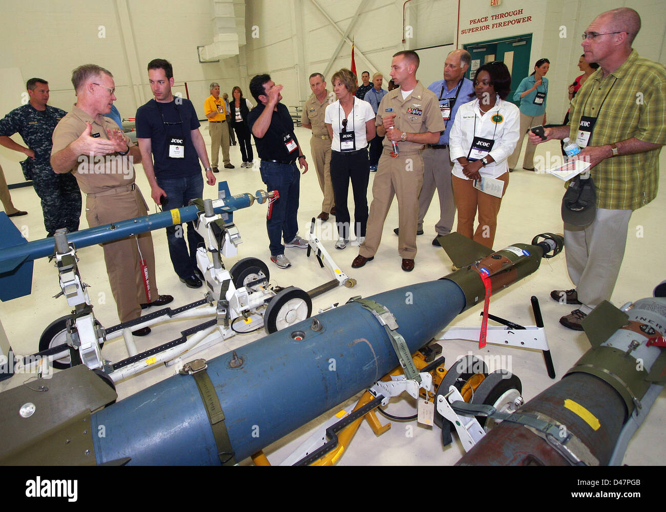 The Naval Education and Training Commander discusses with members of the Joint Civilian Orientation Conference how students at Naval Air Technical Training Center are taught. Stock Photo