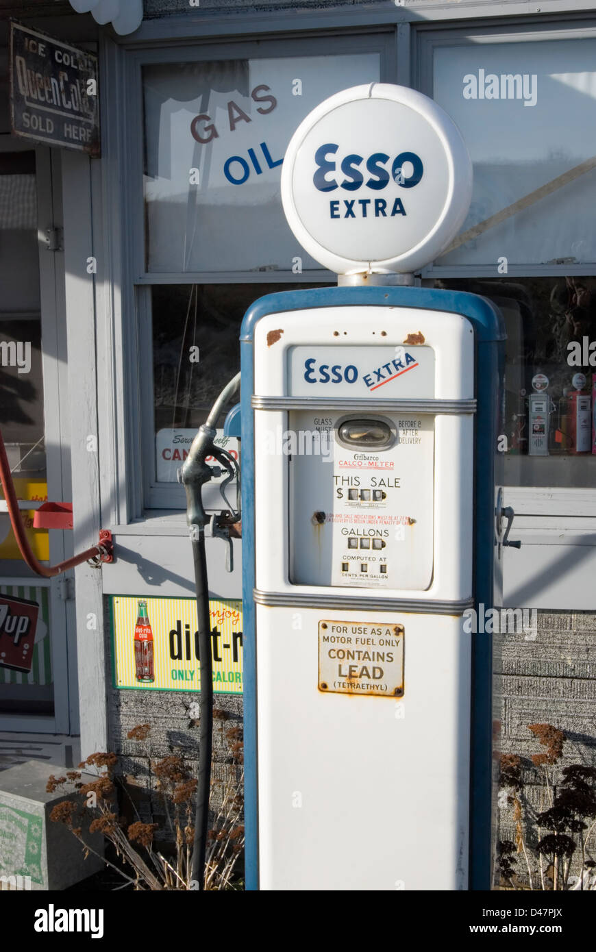 Vintage Esso gas pump in blue paint trim, classic roadside Americana