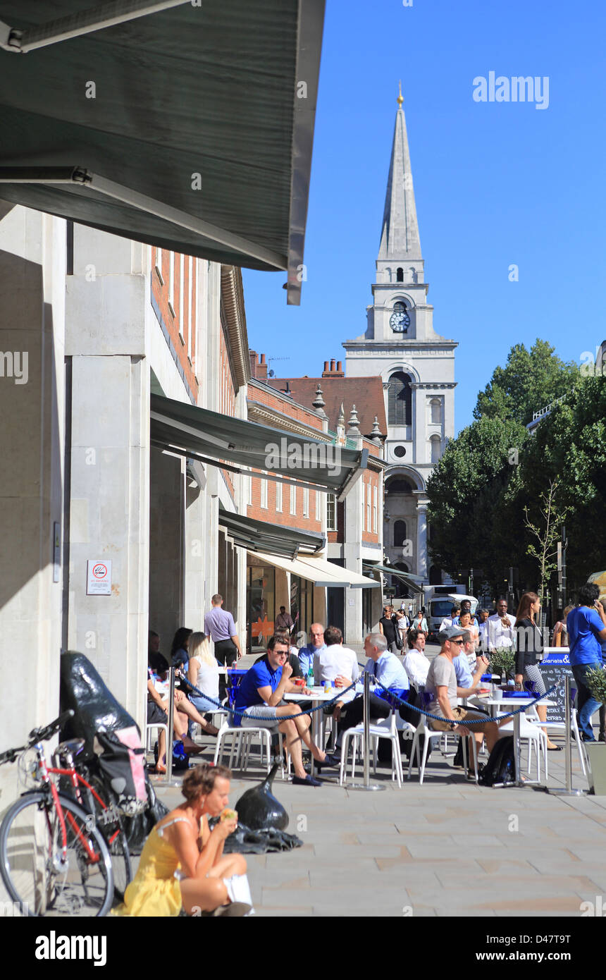 Busy cafes at lunchtime in summer on Brushfield Street next to Old Spitalfields Market, London E1 Stock Photo