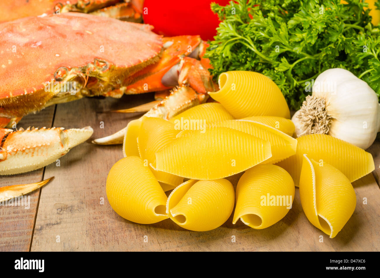 Ingredients for making Dungeness Crab Pasta with garlic and parsley Stock Photo