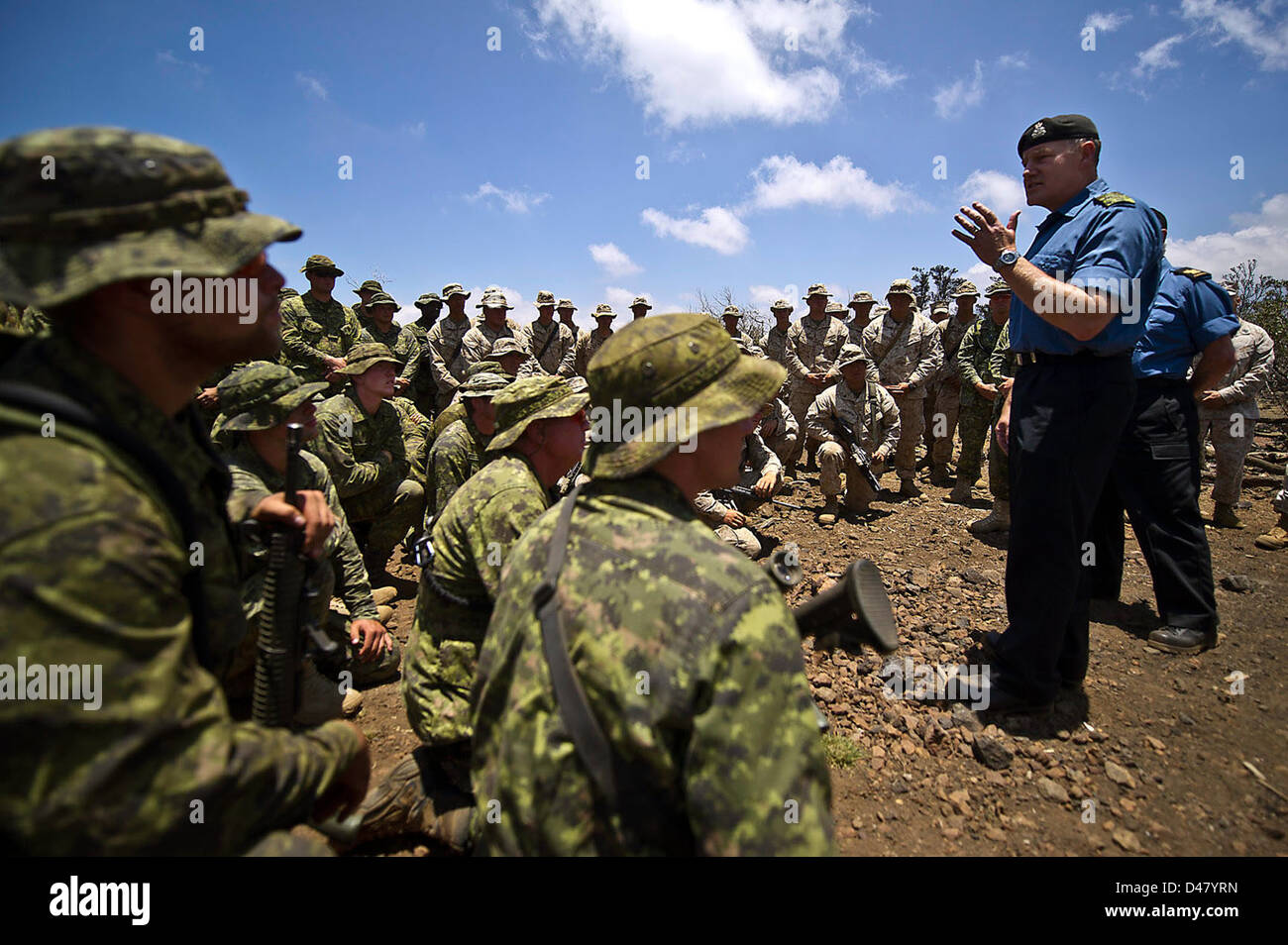 Canadian Chief of Defense speaks with Canadian soldiers and U.S. Marines. Stock Photo