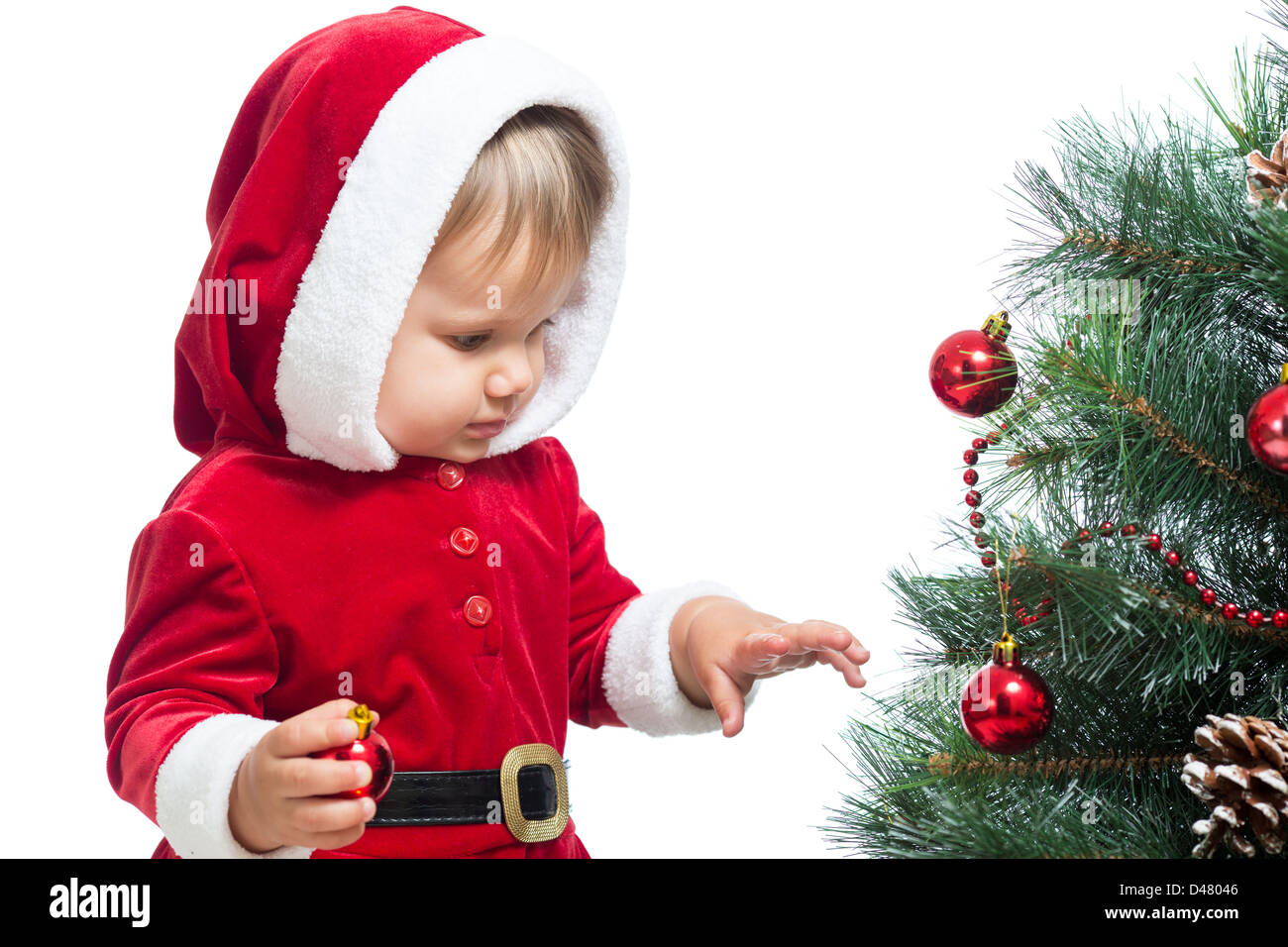 pretty Santa Claus baby decorating Christmas tree isolated on white Stock Photo
