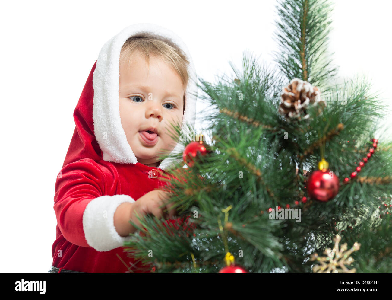 pretty Santa Claus baby decorating Christmas tree isolated Stock Photo