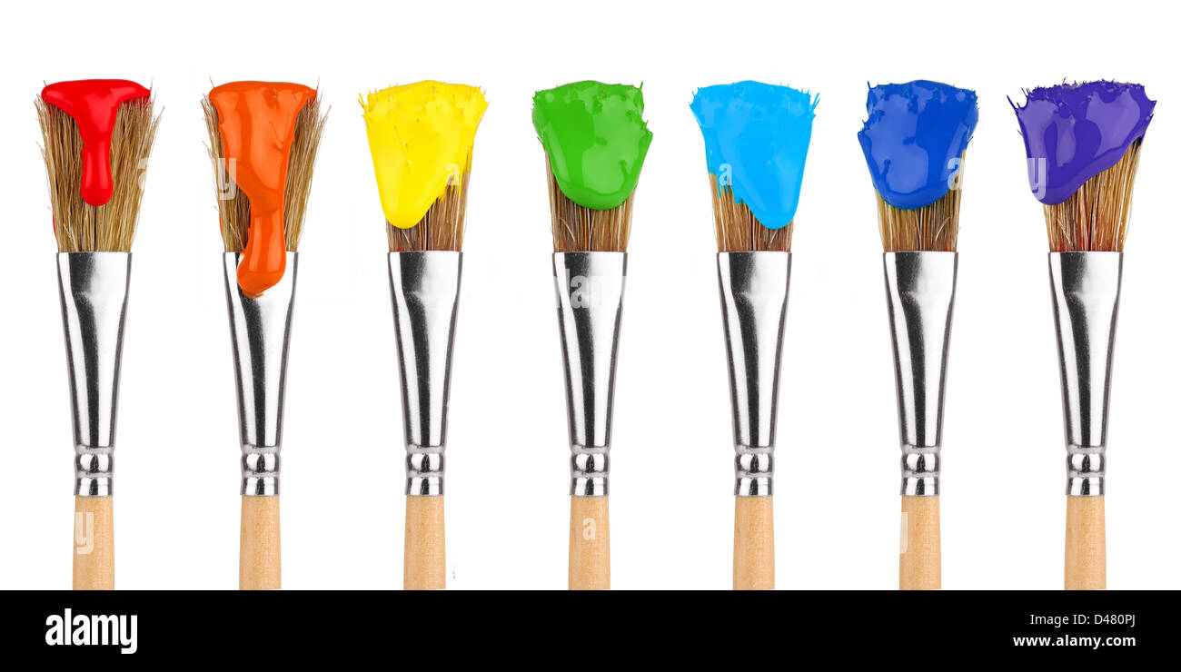 paint brushes with rainbow colors in front of white background Stock