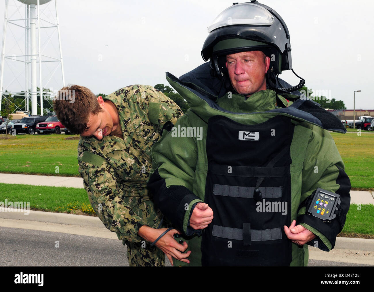 A Sailor puts on a bomb suit Stock Photo Alamy