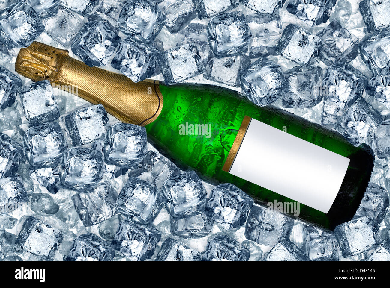 bottle of champagne on ice cubes Stock Photo