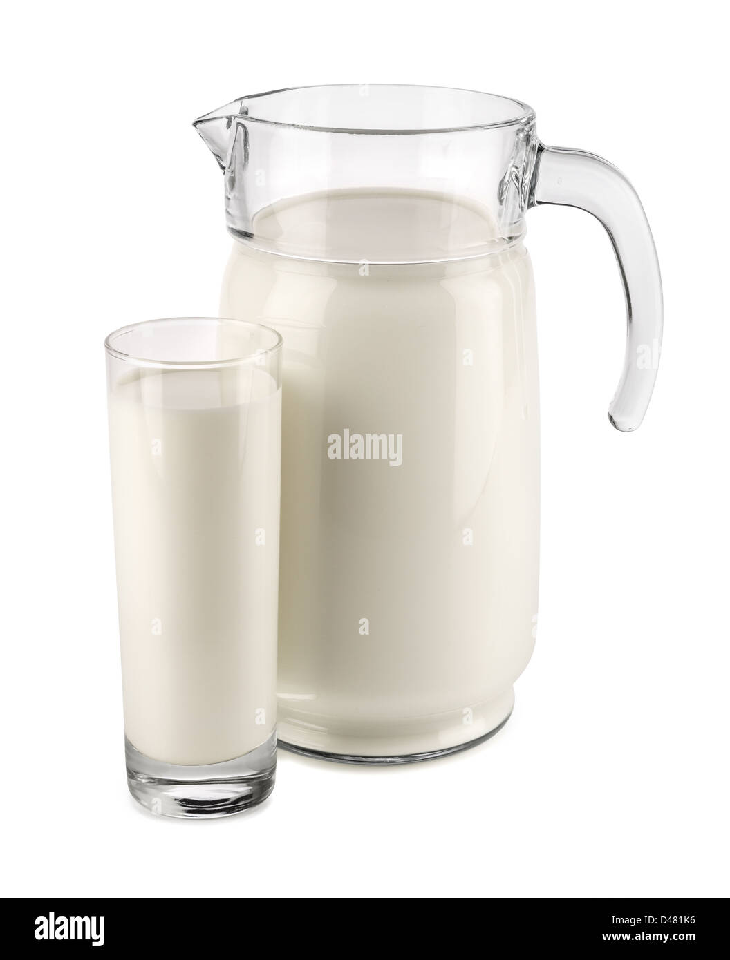 milk jug with glass in front of white background Stock Photo