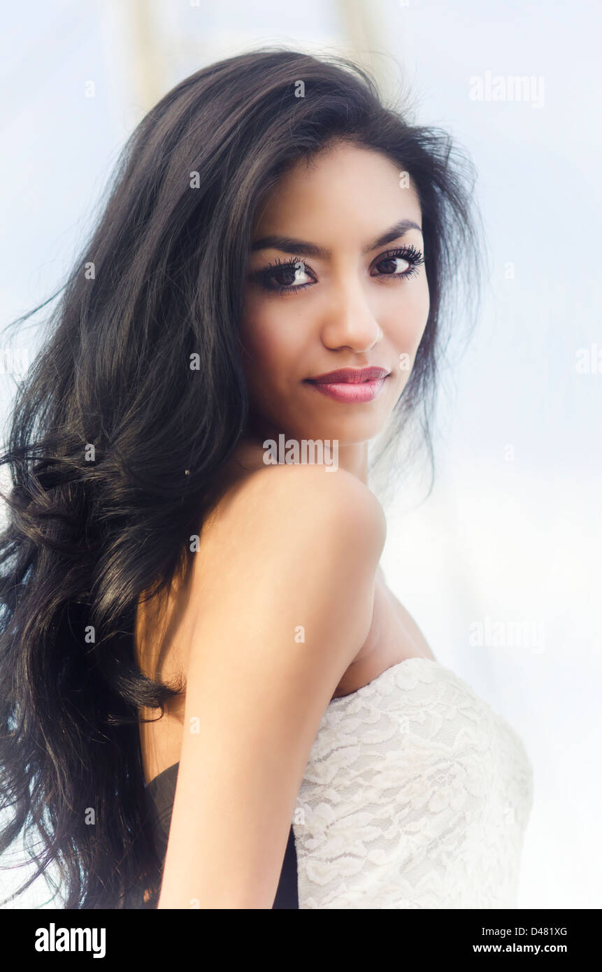 Portrait Of A Beautiful Exotic Young Woman With Long Dark Hair Stock Photo Alamy