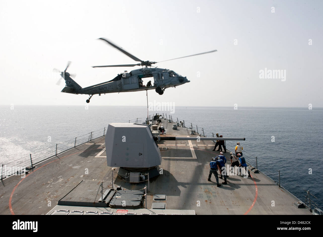 A helicopter picks up cargo Stock Photo Alamy