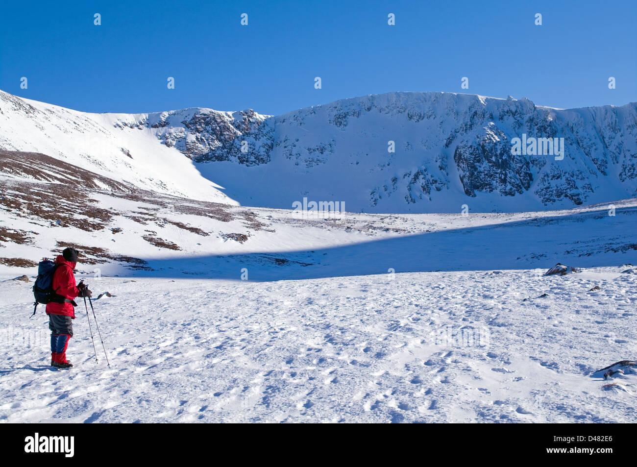 Hillwalker approaching Coire an t-Sneachda,  Northern Corries, Cairngorms National Park, Scottish Highlands, winter, Scotland UK Stock Photo