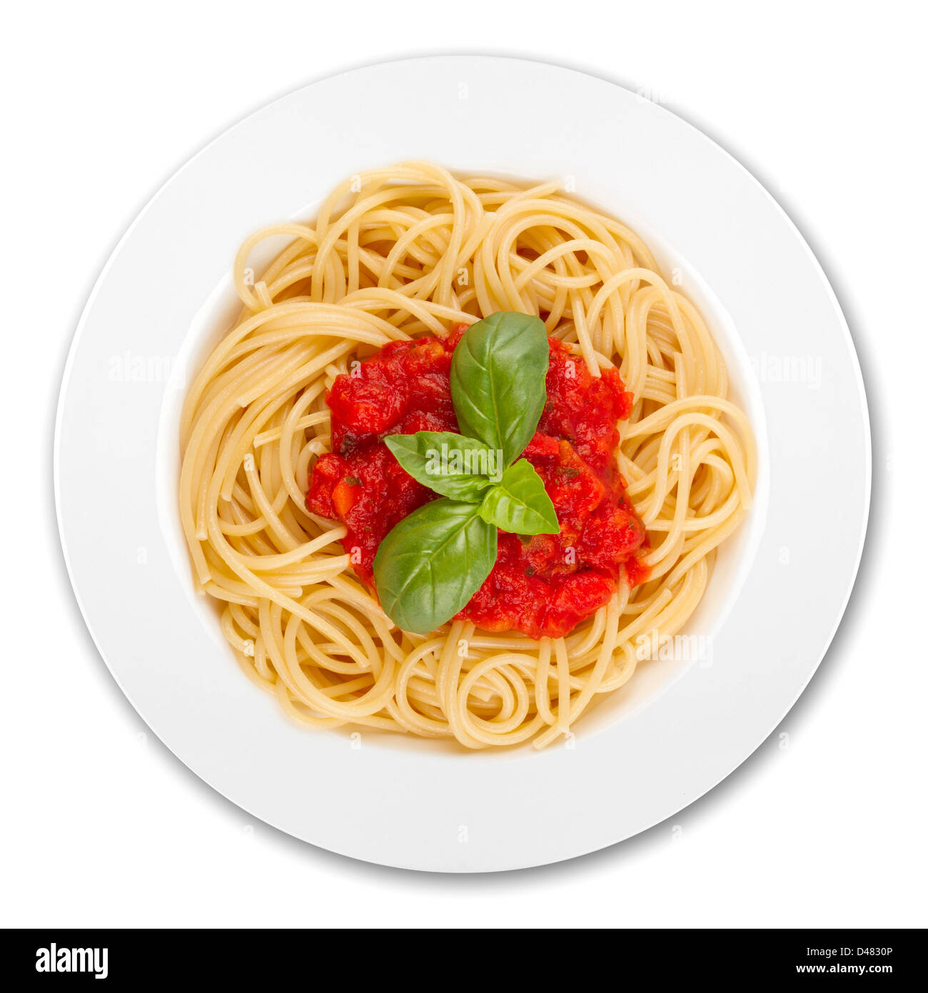 plate with spaghetti, sauce and basil on white background Stock Photo