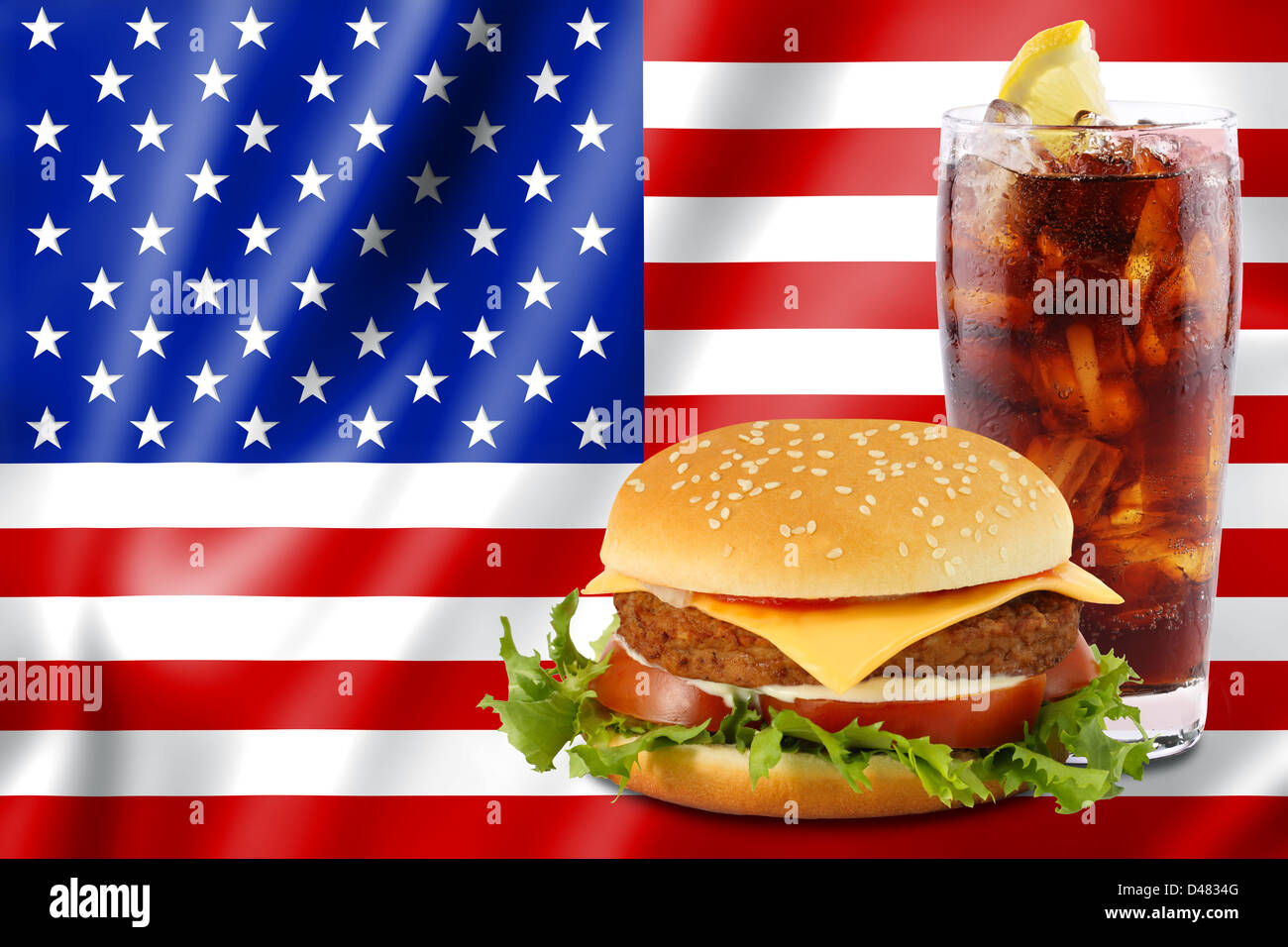 cheeseburger and soda in front of the american flag. Stock Photo