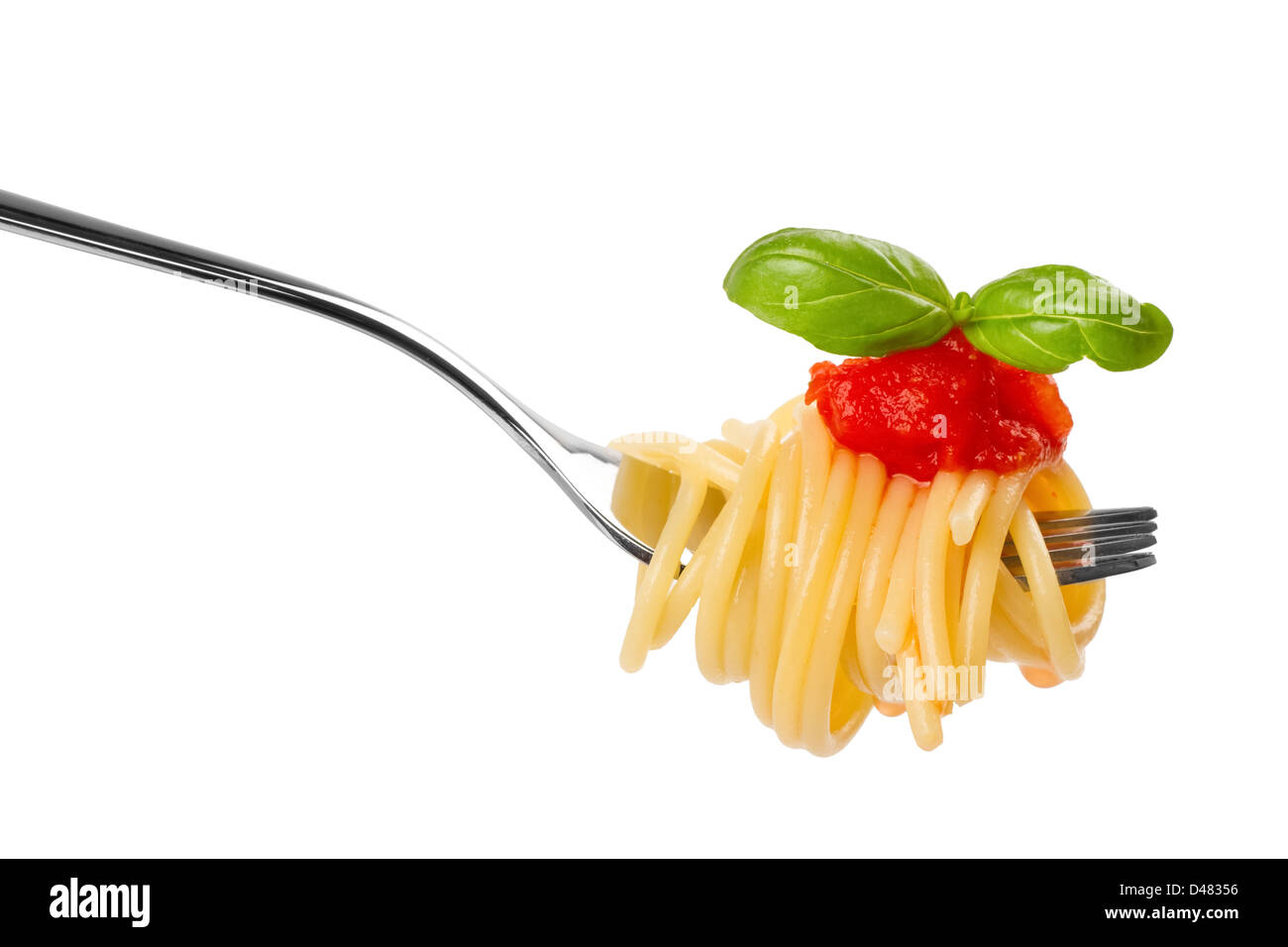 fork with spaghetti sauce and basil on white background Stock Photo Alamy