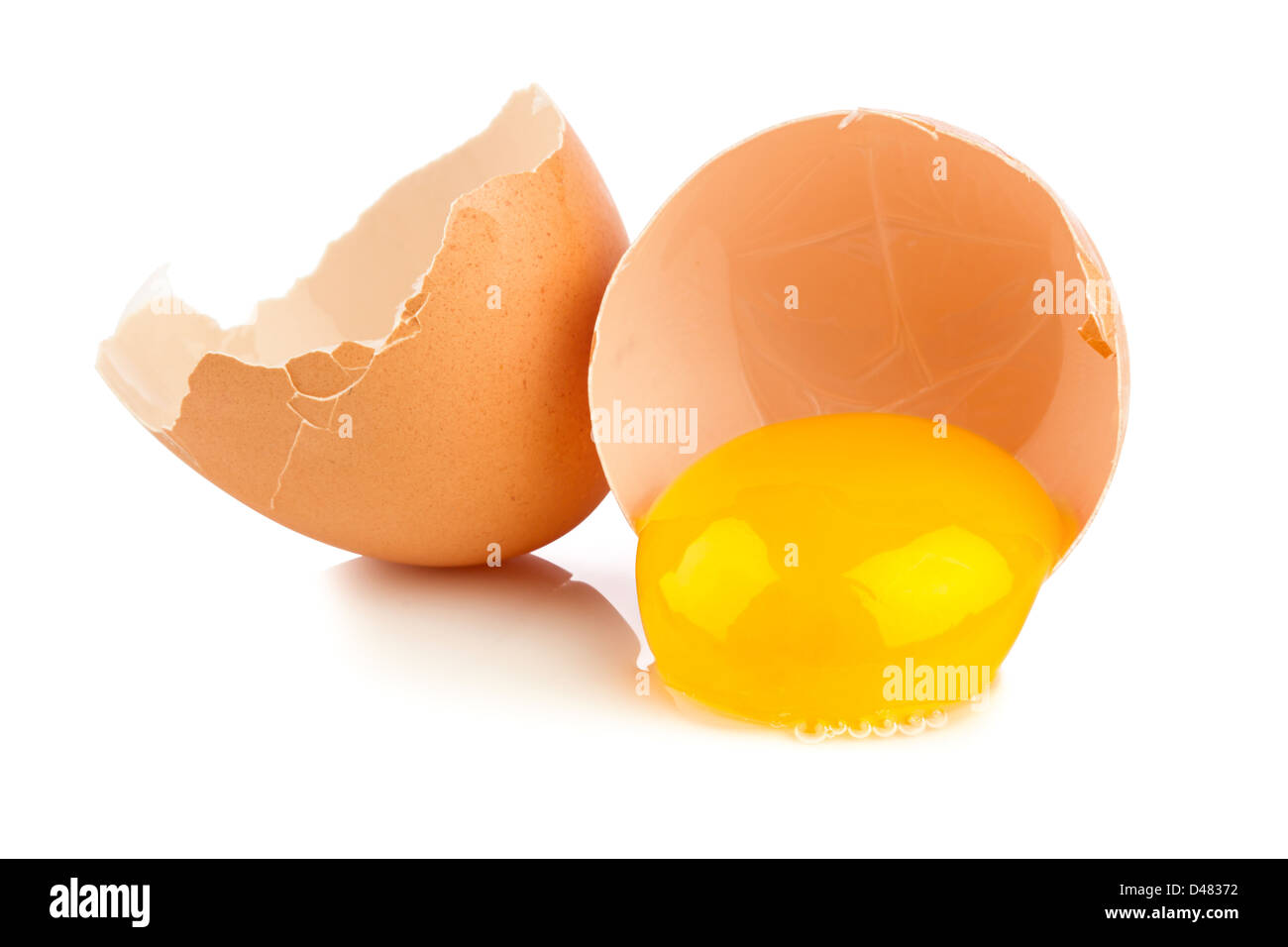 broken chicken egg on white background Stock Photo - Alamy