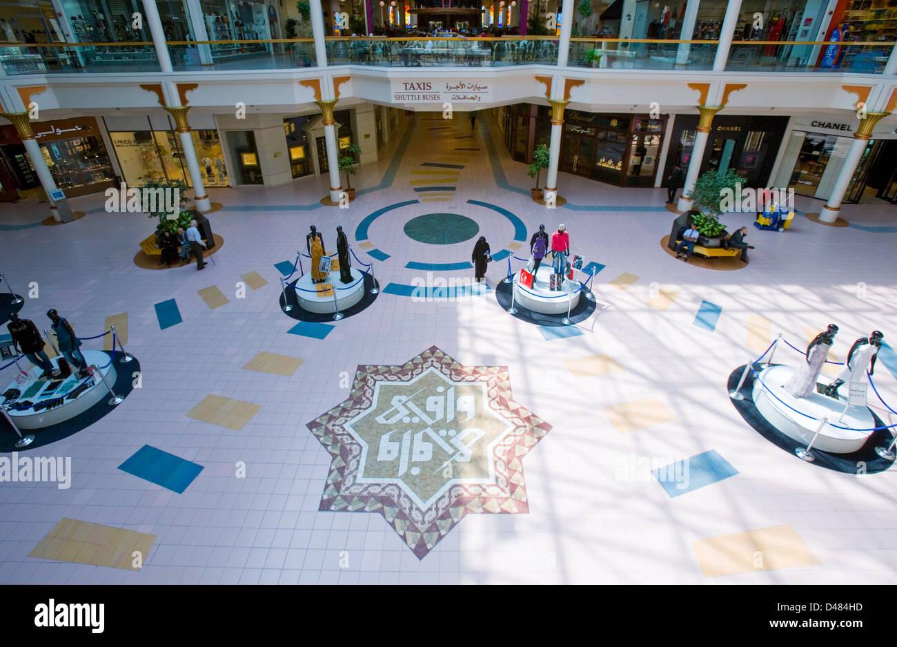 Dubai, people and mannequins in the square of the Wafy City Mall Stock