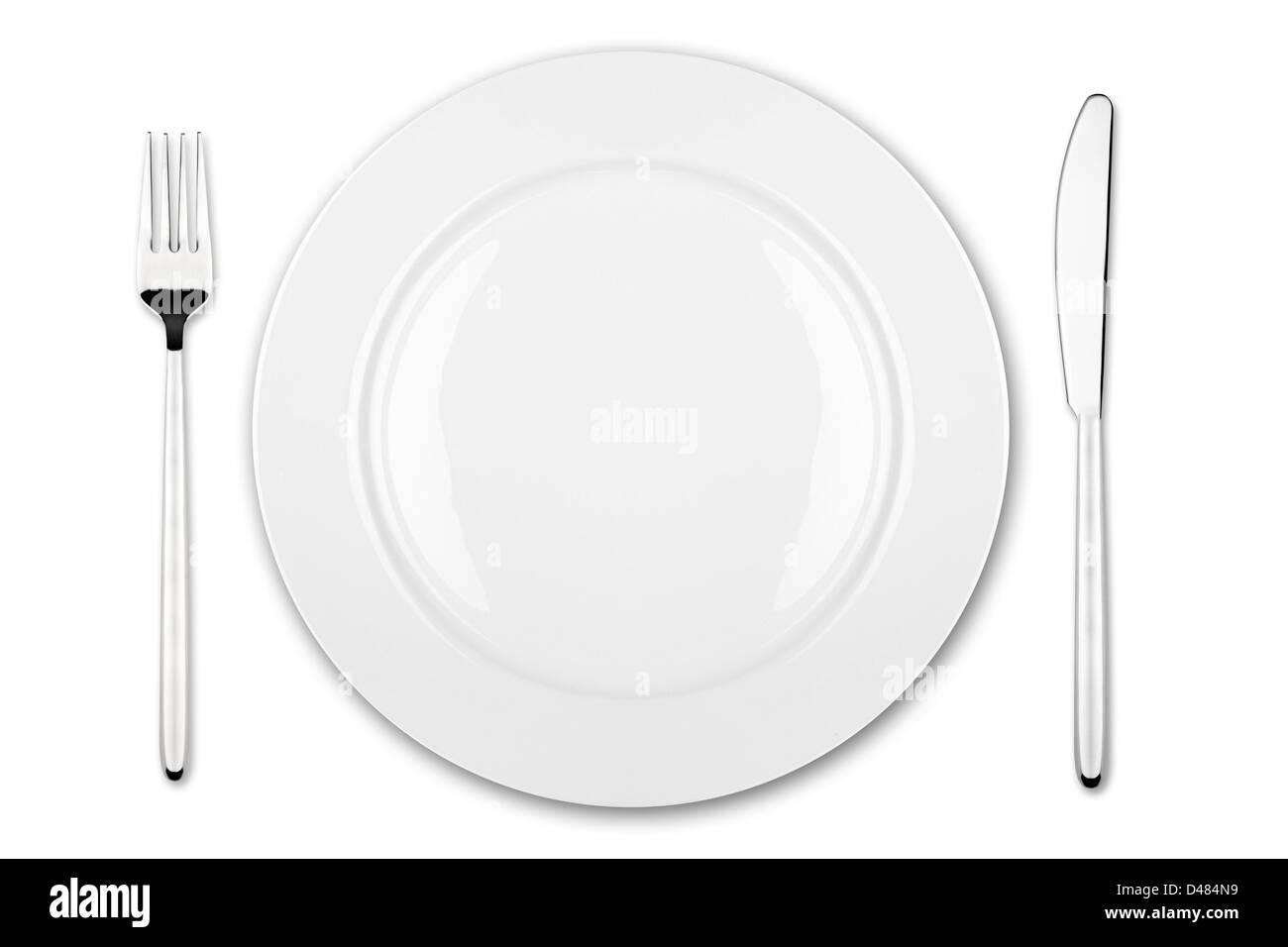 place setting with dish fork and knife Stock Photo