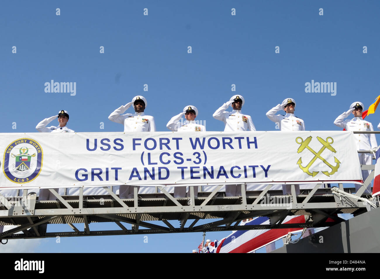 Sailors salute aboard USS Fort Worth. Stock Photo