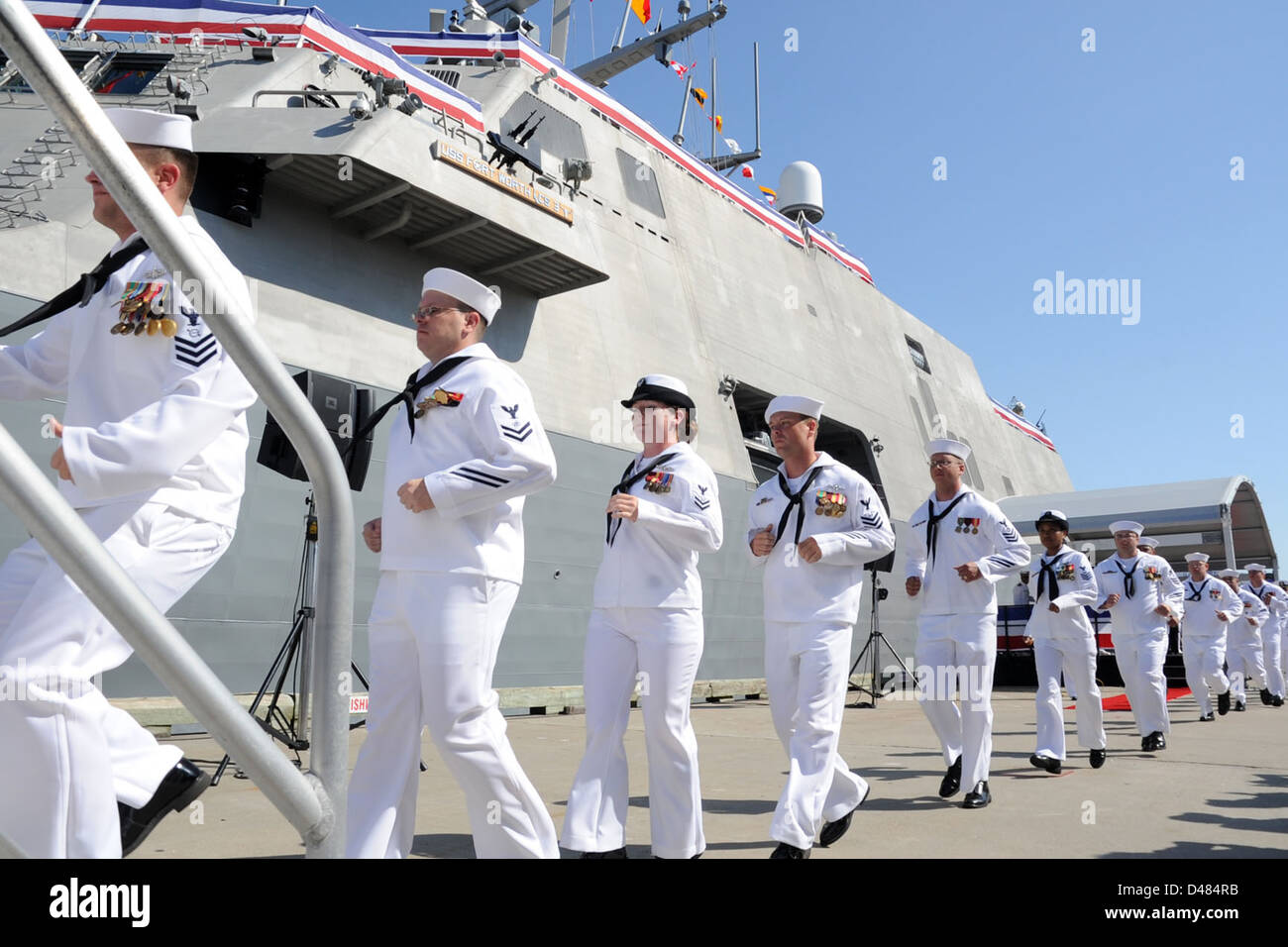 Sailors run aboard USS Forth Worth. Stock Photo