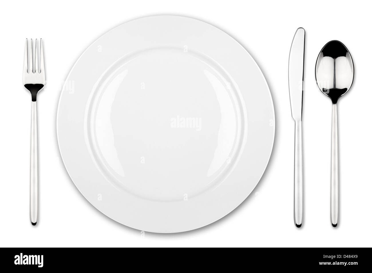 place setting with dish fork and knife Stock Photo