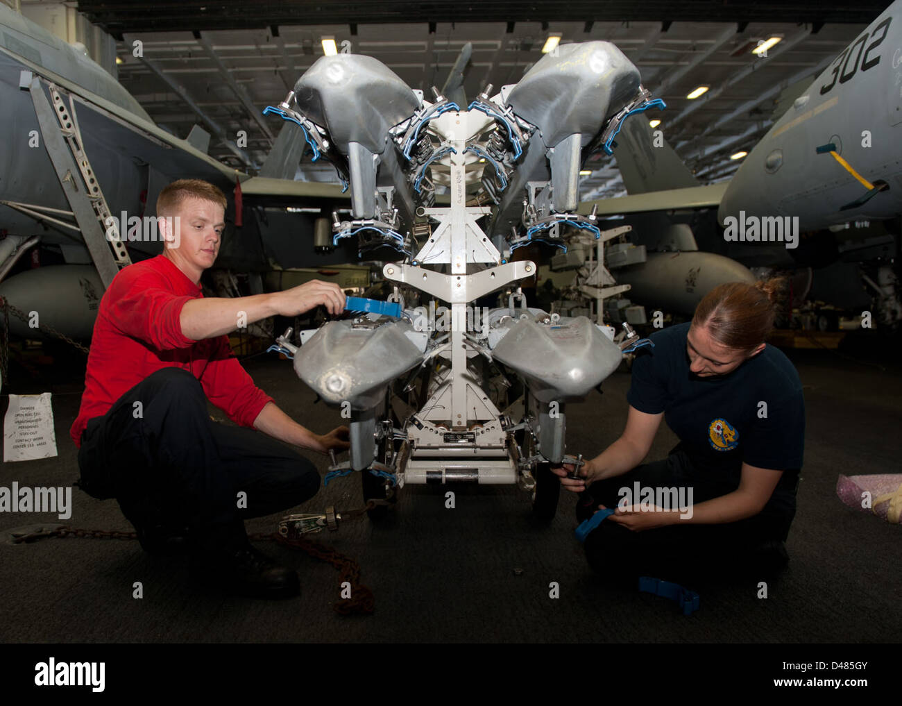 Sailor Make Rack Sailors aboard a U.S. Navy ship reassemble missile racks during routine ...