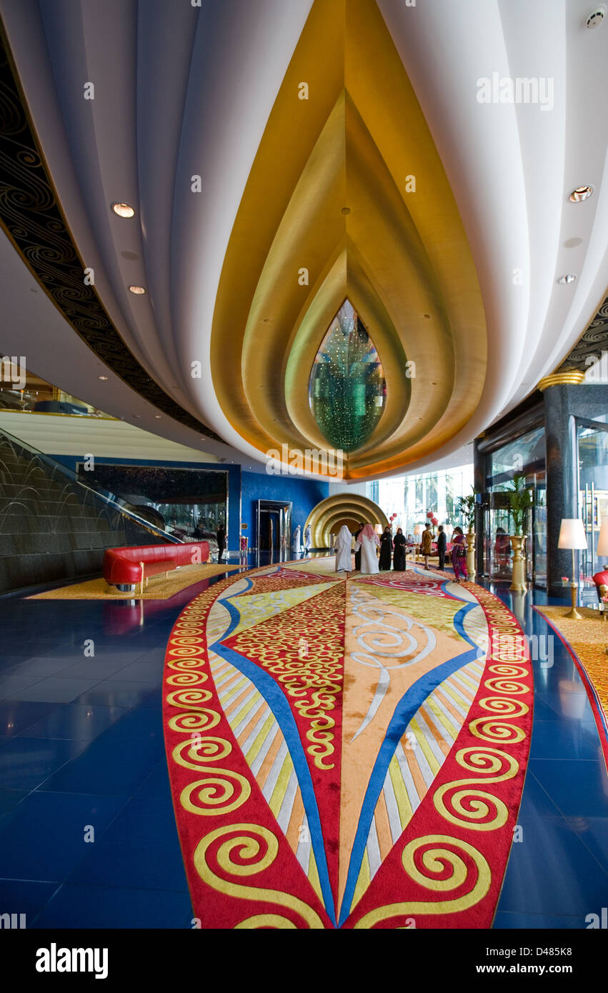 Dubai, the colored reception hall of the luxury Burj Al Arab hotel ...