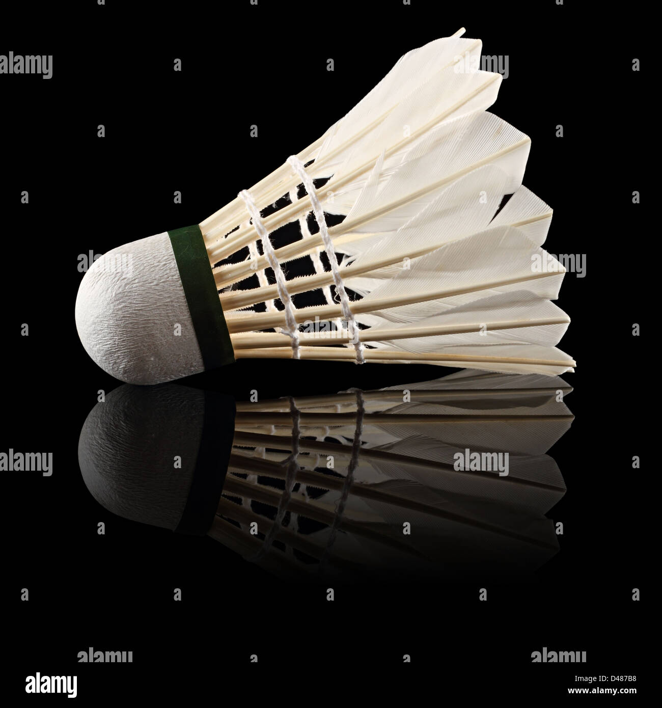 badminton ball in front of black background Stock Photo - Alamy