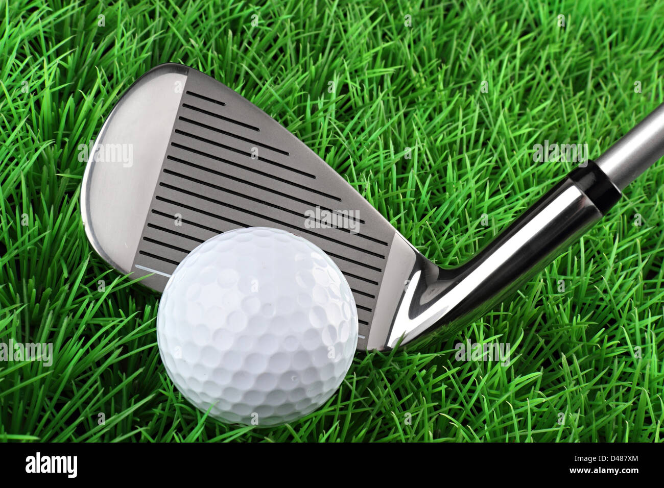 golf club with ball on green Stock Photo