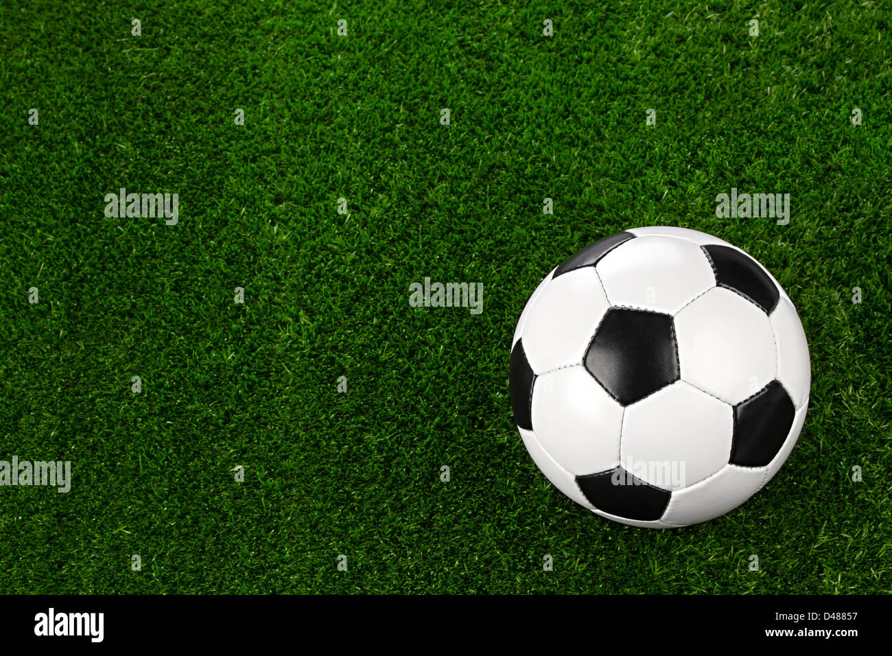 a soccerball on a green meadow Stock Photo