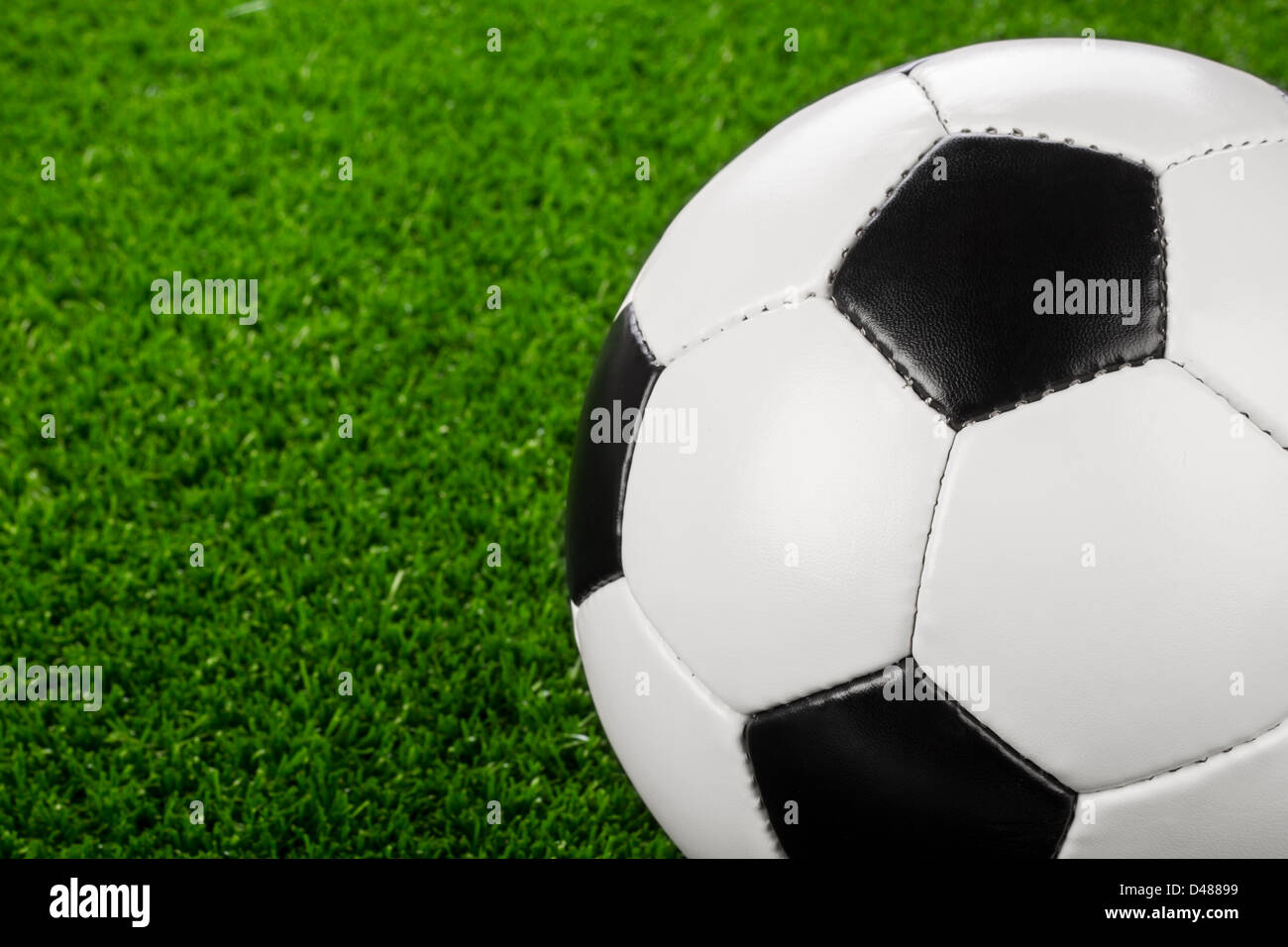 a soccerball on a green meadow Stock Photo