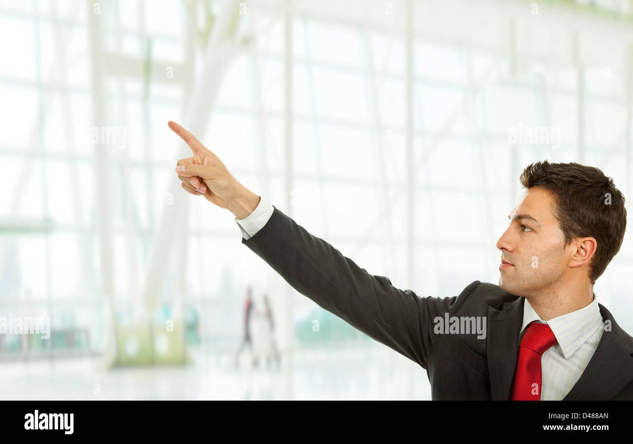young business man in a suit pointing with his finger Stock Photo - Alamy