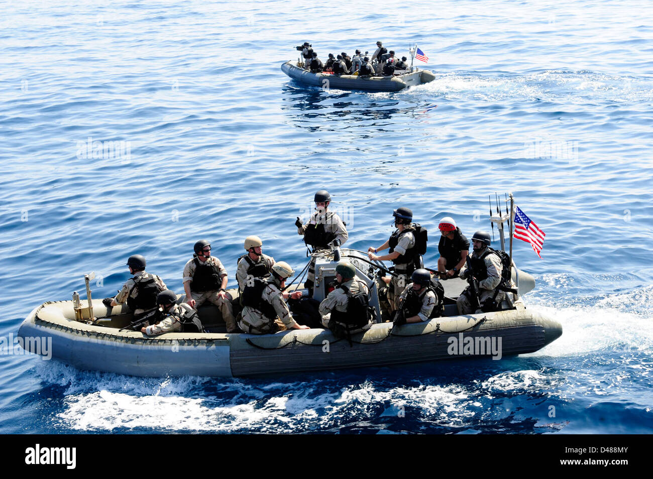 A VBSS team prepares to investigate a vessel. Stock Photo