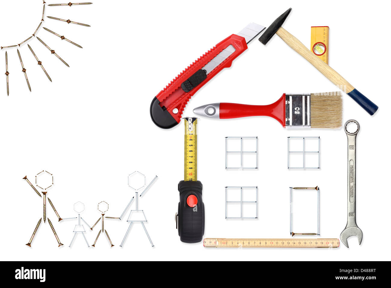 A lucky family in front of their new house. A collage with tools,nails and screws. Stock Photo