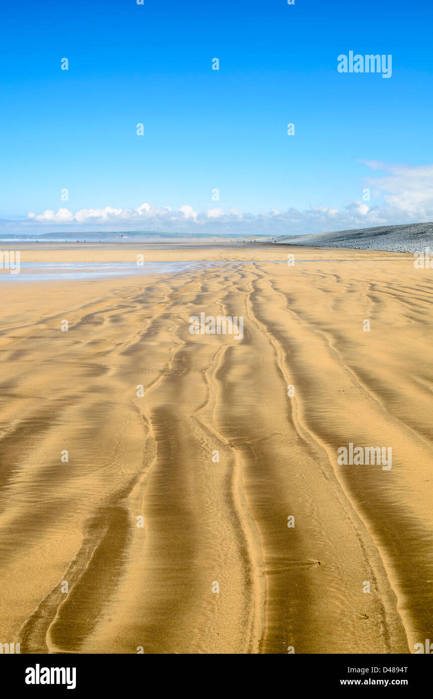 Patterns in the sand left by the retreating tide on the beach at Westward Ho!, Devon, England. Stock Photo