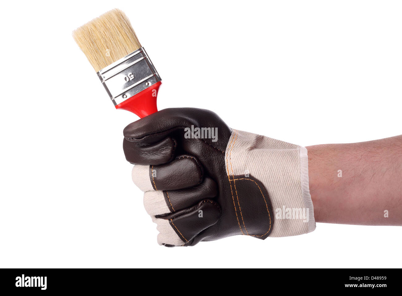 A hand with a paintbrush. Stock Photo
