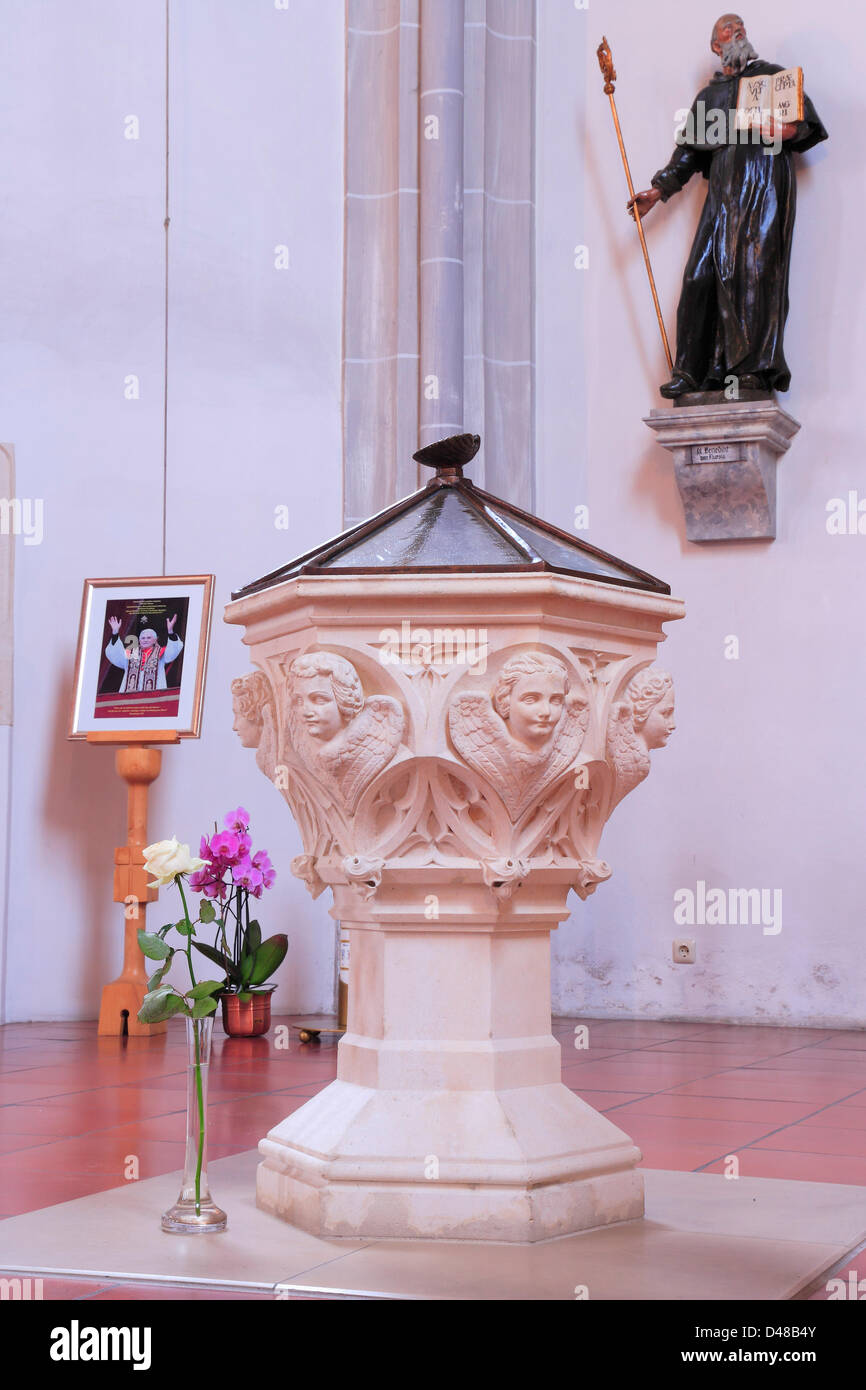 A white rose stands near the baptistry of Joseph Ratzinger in the St ...