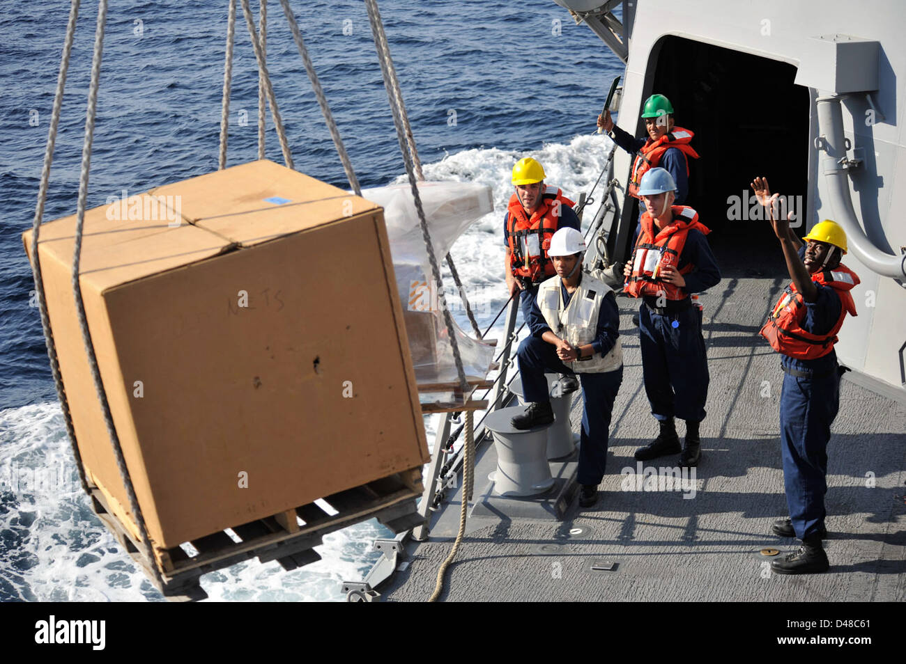 Sailors aboard U.S. Navy vessels receive essential supplies during a ...