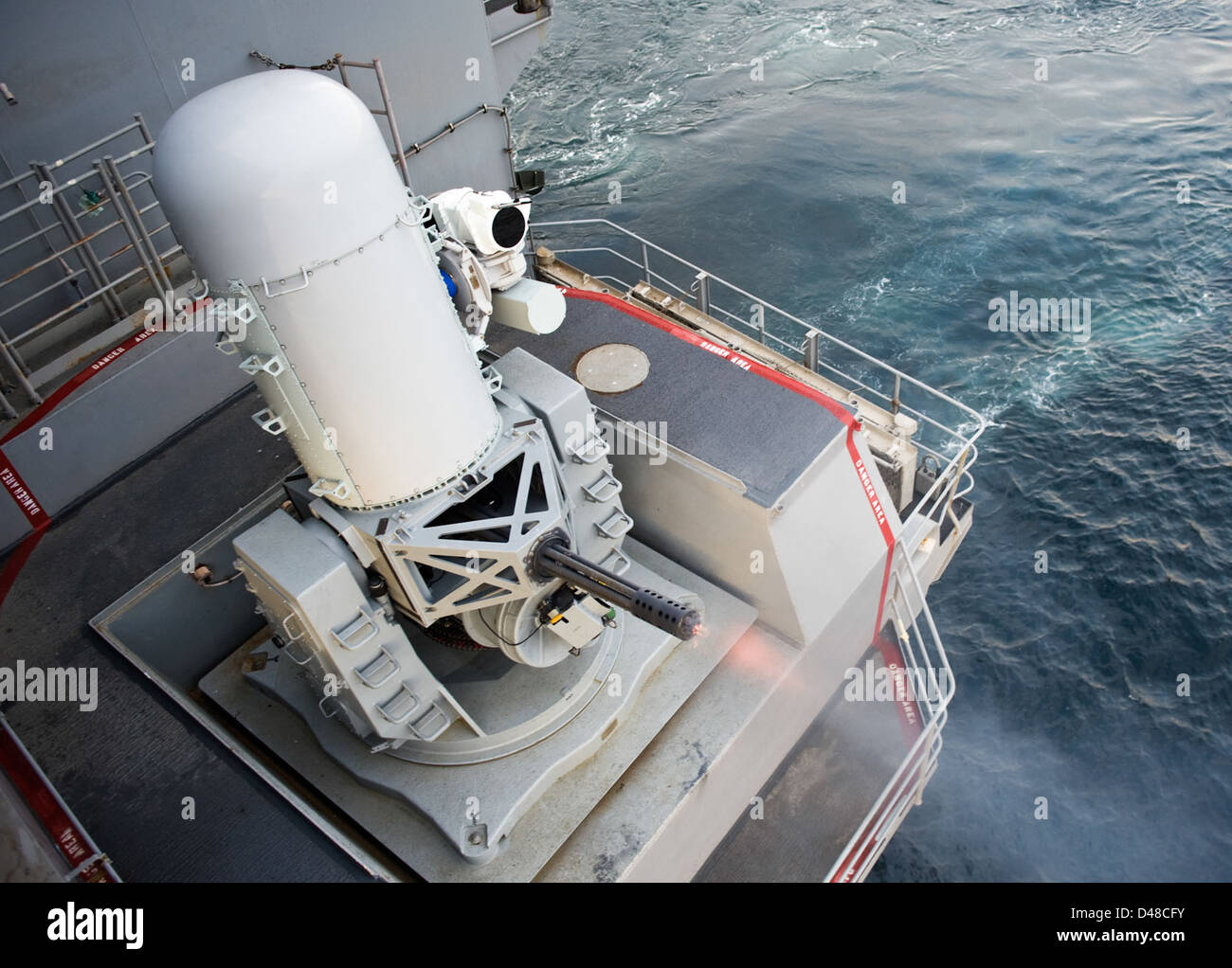 A Close-In Weapon System (CIWS) fires aboard a U.S. Navy ship in the ...