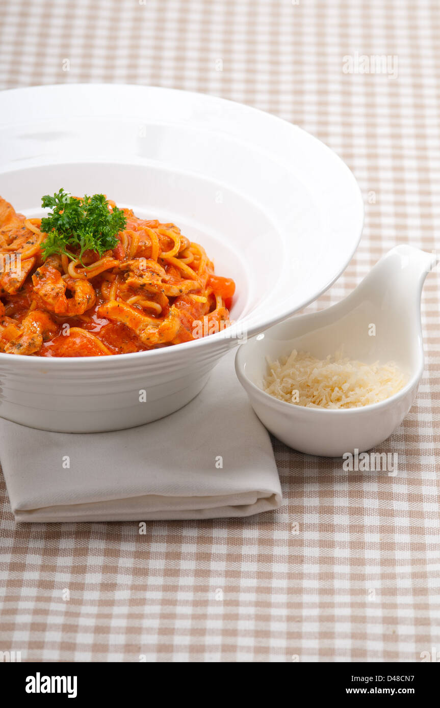 Italian spaghetti pasta with tomato and chicken sauce Stock Photo - Alamy