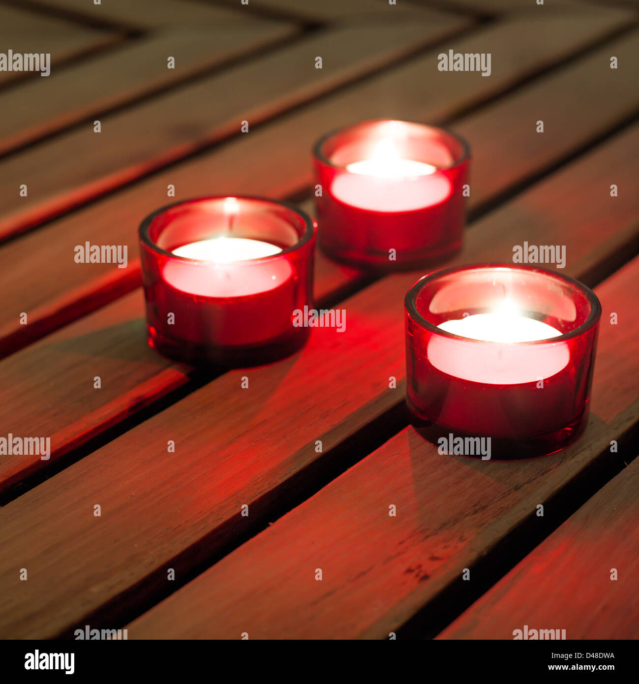 three candles lighting for a relaxing ambiance Stock Photo Alamy